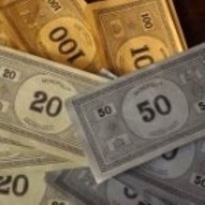 Monopoly money as reminder that gift cards aren't play money and can help reach goals