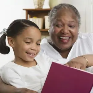 Grandmother reading to child: example of why it's smart to consider magnesium for heart health and learn how to increase magnesium